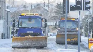  ??  ?? Clearing a way Snow ploughs out and about on Monday