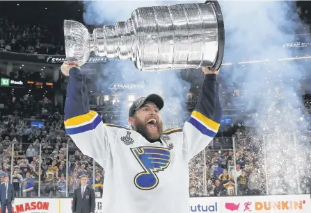  ?? SUBMITTED PHOTO ?? St. Louis captain Alex Pietrangel­o raises the Stanley Cup after the Blues beat the Boston Bruins for their first Cup title last season. The Blues are part of the 24-team playoff format this summer.