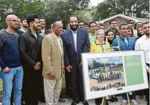  ?? Steve Gonzales / Associated Press ?? Mayor Sylvester Turner and Mohammed bin Salman, Saudi crown prince, visit Habitat for Humanity volunteers Saturday.