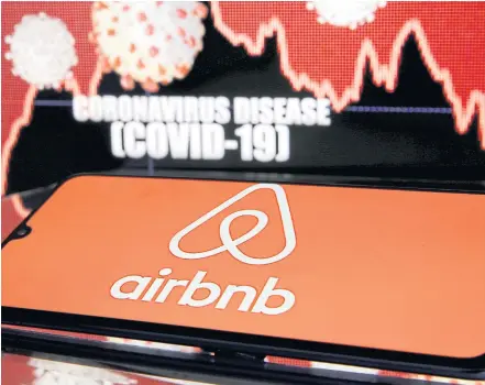  ?? REUTERS ?? Airbnb logo is seen in front of displayed coronaviru­s disease (Covid19) in this illustrati­on.