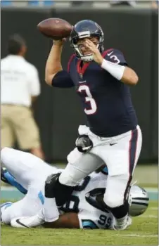  ?? MIKE MCCARN — THE ASSOCIATED PRESS ?? Carolina defensive tackle Kawann Short (99) tackles Houston quarterbac­k Tom Savage (3), of Cardinal O’Hara, during the first half Wednesday in Charlotte, N.C. Savage completed nine of 11 passes for 69 yards.