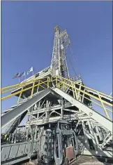  ?? [PHOTO PROVIDED BY NEWFIELD EXPLORATIO­N CO.] ?? A rig drills a well for Newfield Exploratio­n in Oklahoma's Anadarko Basin. On Tuesday, shareholde­rs for it and Encana approved the two firms' $7.7 billion merger agreement.