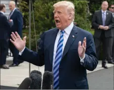  ?? AP PHOTO ?? President Donald Trump speaks with reporters in Washington on Friday.