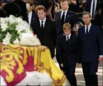  ?? THE ASSOCIATED PRESS ?? Diana’s coffin makes its way to Westminste­r Abbey, Saturday Sept. 6, 1997. Following are, from right, Prince Charles, Prince Harry and Earl Spencer.