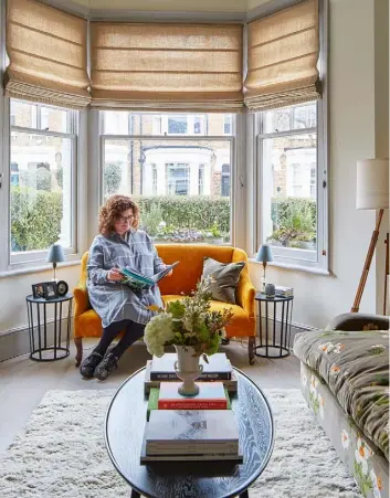  ??  ?? LIVING ROOM
Elizabeth (above) loves to mix old and new.
She found the Victorian settee on Ebay – reupholste­red in Colefax & Fowler’s Theo velvet in Ochre, it brightens the room. The Pinch sofa is covered in
GP&J Baker’s Icelandic Poppies velvet from Liberty. Beneath the Conran for M&S coffee table, a Berber Fawn rug from John Lewis & Partners softens the look