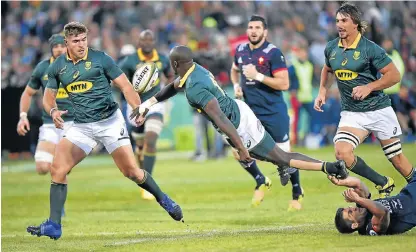  ?? /Christiaan Kotze/Gallo Images ?? Raymond rules: Raymond Rhule offloads to Malcolm Marx with Eben Etzebeth, right, up in support at Loftus on Saturday.