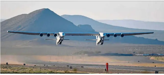  ?? — Reuters ?? Off to a smooth start: Roc taking off on its first test flight in Mojave, California.