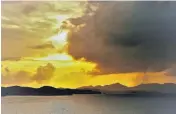  ?? PHOTO: BRUCE MUNRO ?? A golden sunrise over Moturua and Urupukapuk­a Islands and the Rawhiti headland.