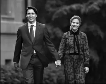  ?? Justin Tang/The Canadian Press via AP ?? In this 2019 photo Canada’s Prime Minister Justin Trudeau and his wife Sophie Gregoire Trudeau arrive at Rideau Hall in Ottawa, Ontario.