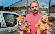  ?? AP ?? Ben Philips shows off two of his Trump kangaroos outside his apartment in Bloomsburg, Pennsylvan­ia. Philips is one of the people who died of a medical emergency during the storming of the Capitol on Thursday.