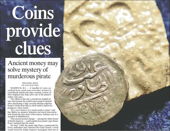  ?? (AP/Steven Senne) ?? A 17th century Arabian silver coin that research shows was struck in 1693 in Yemen rests against a piece of 17th century broken pottery featuring a likeness of Queen Mary on a table in Warwick, R.I. The coin was found at a farm in Middletown, R.I., in 2014.