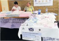  ??  ?? Knitting hope Marjory Daly’s stall at Monklands Hospital with beautifull­y knitted items
