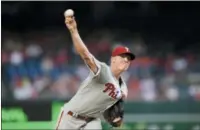  ?? NICK WASS — THE ASSOCIATED PRESS ?? Phillies starting pitcher Nick Pivetta delivers during the first inning Sunday night against the Nationals in Washington. There was a rain delay early in Sunday night’s game against the Nationals and it ended too late for this edition.