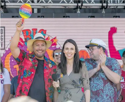 ?? Photo / Peter Meecham ?? Jacinda Ardern was a hit as she took the Big Gay Out stage alongside deputy Grant Robertson (right) and MP Ta¯ mati Coffey, who announced to cheers that he and partner Tim Smith are expecting a baby by surrogate.