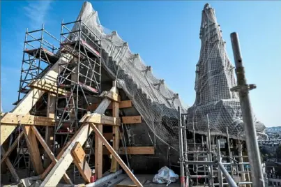  ?? Stephane de Sakutin/ Associated Press ?? Scaffoldin­g has been erected for preliminar­y repair work on Notre Dame Cathedral on Wednesday in Paris.