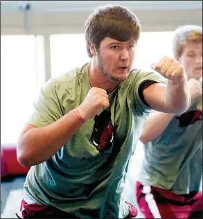  ?? NWA Democrat-Gazette file photo ?? Freshman offensive lineman Kirby Adcock of Nashville, seen in this January photo, arrived at Arkansas weighing 300 pounds. He’s now at 290 after spending a semester in the offseason conditioni­ng program. “I haven’t lost that many pounds, but I’ve lost...