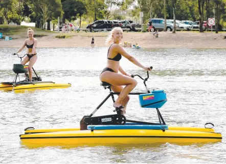  ?? Picture: MIKE BATTERHAM ?? German tourists Line Huebner and Fenja Liebing give the hydro bikes a go.