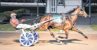  ?? GAIL MACDONALD/SPECIAL TO THE GUARDIAN ?? Ramblingli­ly, with Gary Chappell at the lines, cross the finish line at Red Shores at the Charlottet­own Driving Park in this file photo.