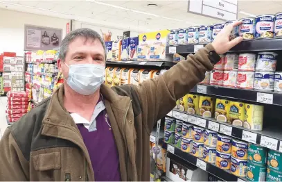  ?? Pictures: Brian Sokutu ?? CASH CRUNCH. Kempton Park resident Louis Steenkamp is finding shopping harder and more expensive during the pandemic as some items are out of stock and food prices are higher.