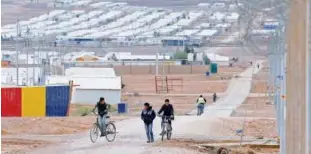  ?? File/ Reuters ?? Syrian refugee children ride their bicycles at Azraq refugee camp, near Al Azraq city, Jordan.