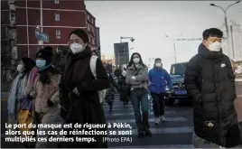  ?? (Photo EPA) ?? Le port du masque est de rigueur à Pékin, alors que les cas de réinfectio­ns se sont multipliés ces derniers temps.