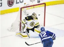  ??  ?? Toronto Maple Leafs forward Patrick Marleau scores his second goal of the night on Boston Bruins goalie Tuukka Rask in the Leafs’ 4-2 win Monday.