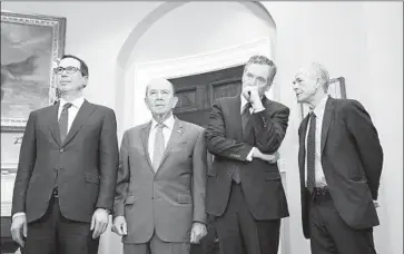  ?? Jabin Botsford The Washington Post ?? TREASURY SECRETARY Steven T. Mnuchin, left, Commerce Secretary Wilbur Ross, U.S. Trade Representa­tive Robert Lighthizer and senior White House advisor Peter Navarro at the White House in March.