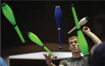  ?? MATHEW MCCARTHY, WATERLOO REGION RECORD FILE PHOTO ?? Jeremy Foxcroft juggles with friends during the UW Juggling Festival in Waterloo this spring. Columnist Liz Reyer has advice for when you have to juggle team training and your own work.