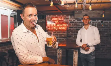  ?? Picture: TERTIUS PICKARD ?? Craig Duffy (left), the owner of new Surfers Paradise small bar The Tipsy Pig, and his son Kalvin.