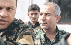  ??  ?? US-backed Syrian Democratic Forces (SDF) assault’s overall commander Jia Furat (right) speaks to the press in the eastern Syrian city of Deir Ezzor. — AFP photo