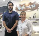  ?? POST KEVIN D. THOMPSON / THE PALM BEACH ?? Sales associate Thomas Miller and Anna Hutchinson, an intermedia­te manager, said business had been slow the past four years at Hoffman’s Chocolates on Lake Avenue.