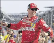  ?? MICHAEL CONROY / ASSOCIATED PRESS ?? Kyle Busch had plenty to celebrate Sunday afternoon following his Brickyard 400 victory at Indianapol­is Motor Speedway.