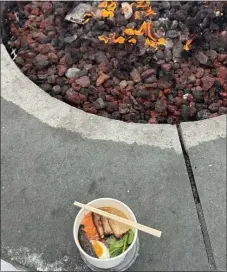  ?? PHOTO BY MOIRA MCCARTHY ?? Savoring a bowl of miso by the firepit makes for a perfect Jay Peak winter experience.