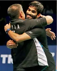  ?? AP ?? Srikanth Kidambi hugs his coach Mulyo Handoyo after winning the men’s singles title at the Indonesia Open badminton championsh­ip in Jakarta on Sunday. —