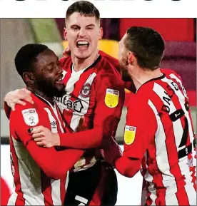  ?? ?? SEVENTH HEAVEN: Sergi Canos (centre) celebrates scoring Brentford’s fifth