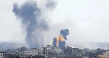  ?? (AP Photo) ?? Smoke rises from an explosion caused by an Israeli air strike in Gaza City, Saturday, May 4, 2019. The sudden outbreak of fighting came as leaders from Hamas, the militant group that controls Gaza, and the smaller armed faction Islamic Jihad were in Egypt for talks with mediators aimed at restoring a fraying ceasefire. Hamas leaders have hoped the recent calm would pave the way for a deeper, longer-term ceasefire understand­ing.