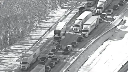  ?? WJLA PHOTOS VIA AP ?? Hundreds of motorists were stranded all night in snow and freezing temperatur­es along a 50-mile stretch of Interstate 95 after a crash involving six tractor-trailers in Virginia.