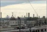  ?? KATHLEEN CAREY – DIGITAL FIRST MEDIA ?? The outline of the Marcus Hook Industrial Complex towers over the borough of Marcus Hook. The Mariner East 2 pipeline plan is rejuvenati­ng the old Sunoco refinery and the town, but at what cost?