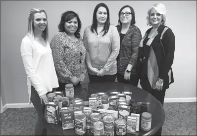  ?? CONTRIBUTE­D PHOTO ?? Employees of First Bank of Calhoun recently donated items to the Voluntary Action Center’s Food Bank.