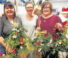  ??  ?? Talented Shona Beattie (left) and Jennifer Lamond (right) made festive wreaths under the expert guidance of Jillian Page from Something Special Flowers (centre)