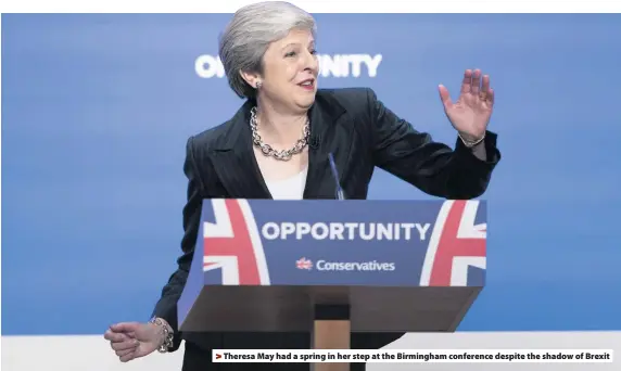  ??  ?? &gt; Theresa May had a spring in her step at the Birmingham conference despite the shadow of Brexit