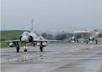  ?? AP FILE PHOTO ?? DEFENSE DRILL
Taiwanese Mirage 2000 fighter jets taxi along a runway during a drill at an air base in the city of Hsinchu, northweste­rn Taiwan on Jan. 11, 2023.