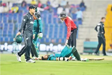  ??  ?? Pakistan opener Imam Ul-Haq lies on the pitch after being hit by a ball during the second one day internatio­nal on Friday. - AFP photo