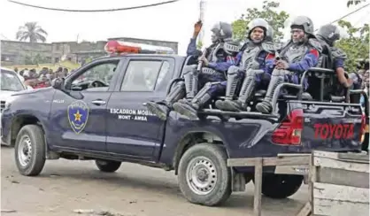  ??  ?? KINSHASA: Congolese police patrol outside the main prison in Kinshasa, Congo, yesterday. Christian sect members stormeda prison in Congo’s capital yesterday, freeing the leader of their movement and 50 others, Congo’s justice minister said. Bundu dia...