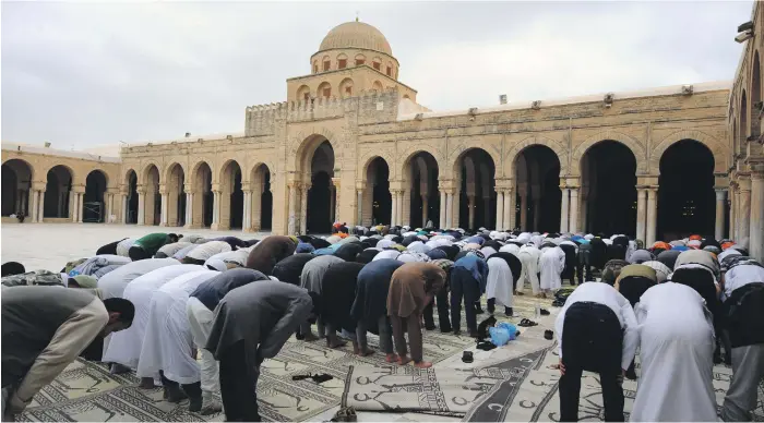  ?? AFP ?? Worshipper­s pray at Great Uqba Mosque. The ninth century building, one of the holiest sites in Islam, draws pilgrims and tourists from across the Middle East and North Africa