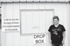  ?? RACHEL DICKERSON/MCDONALD COUNTY PRESS ?? Angie Martin, executive director of Crosslines of McDonald County, is pictured with a new, more secure drop box the nonprofit built after the old one experience­d thefts.