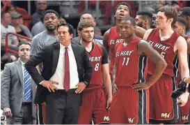  ?? STEVE MITCHELL / USA TODAY SPORTS ?? Miami Heat head coach Erik Spoelstra stands in front of his players during a timeout in the second half against the Toronto Raptors at American Airlines Arena on March 11.