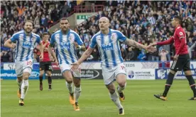  ??  ?? Aaron Mooy celebrates giving Huddersfie­ld the lead against Manchester United