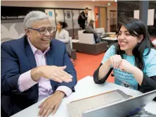  ??  ?? McMaster’s dean of engineerin­g Puri and engineerin­g student Asif