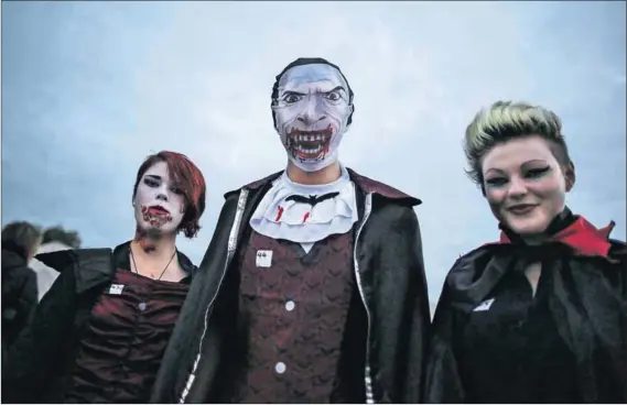  ?? Photo: Peter Macdiarmid/Getty Images ?? Not the real thing: A trio of vampires arrive at the Shocktober Fest in West Sussex. Each October thousands attend the United Kingdom’s biggest Halloween themed attraction. The South African vampyres were less eager to have their picture taken.